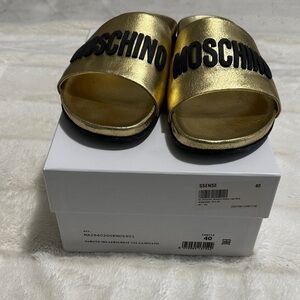 Moschino Metallic Gold Slides with Black Lettering